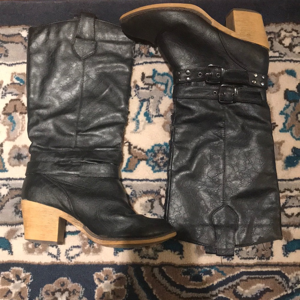 Black heeled mid-calf boots.